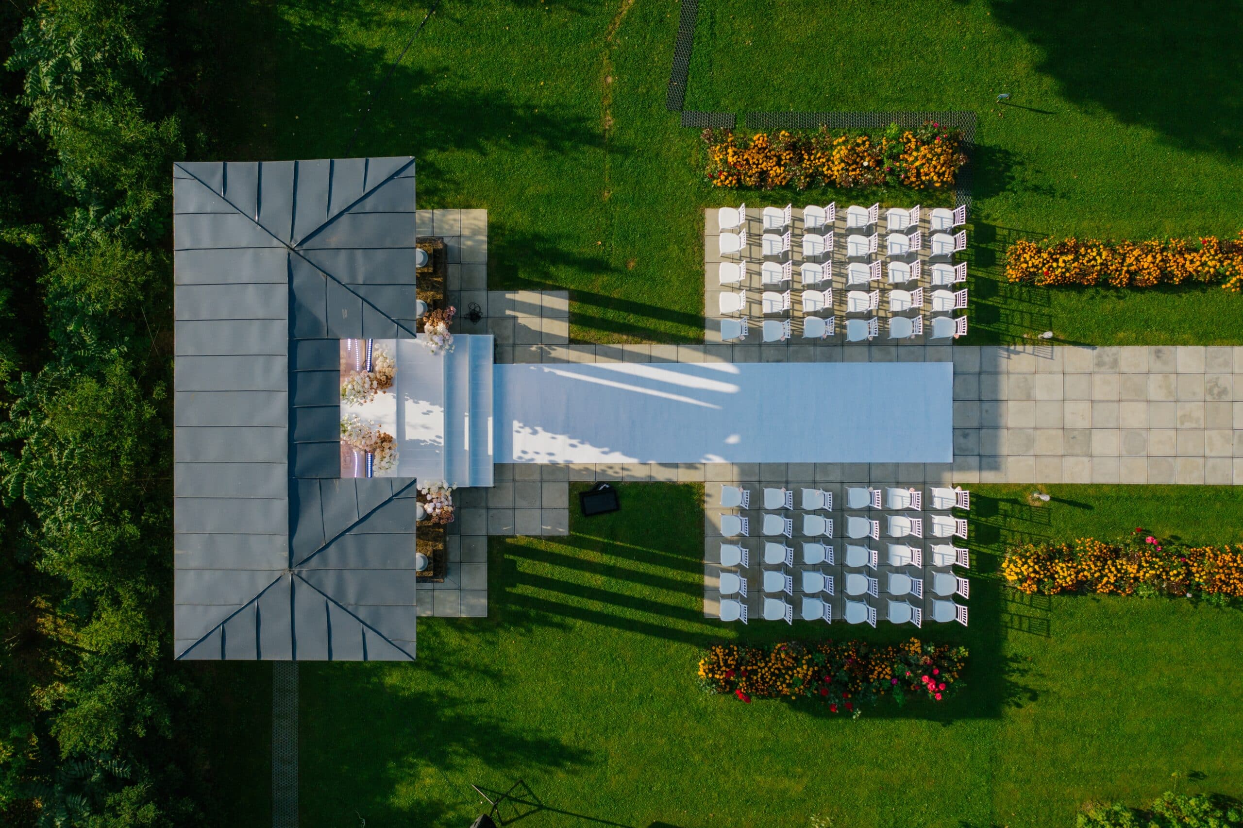 Event Venue Photo by Mikhail Nilov: https://www.pexels.com/photo/aerial-footage-of-a-venue-8414416/