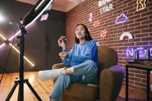 https://www.pexels.com/photo/a-woman-recording-herself-with-a-smartphone-7676402/ -- influencer in social media 