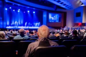 Image Source: https://www.pexels.com/photo/audience-looking-at-the-stage-7780108/ Image Text: Team at a Broadway Show Alt-Text: Audience Watching a Broadway Show Description: Corporate Employees Enjoying a Broadway Show