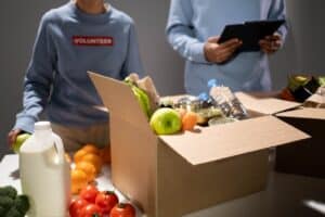 Image Source: https://www.pexels.com/photo/food-and-drinks-inside-the-carton-box-6590920/ Image Text: Corporate Volunteering Event Alt-Text: Team Volunteering at a Food Drive Description: Team Food Drive Volunteering Event