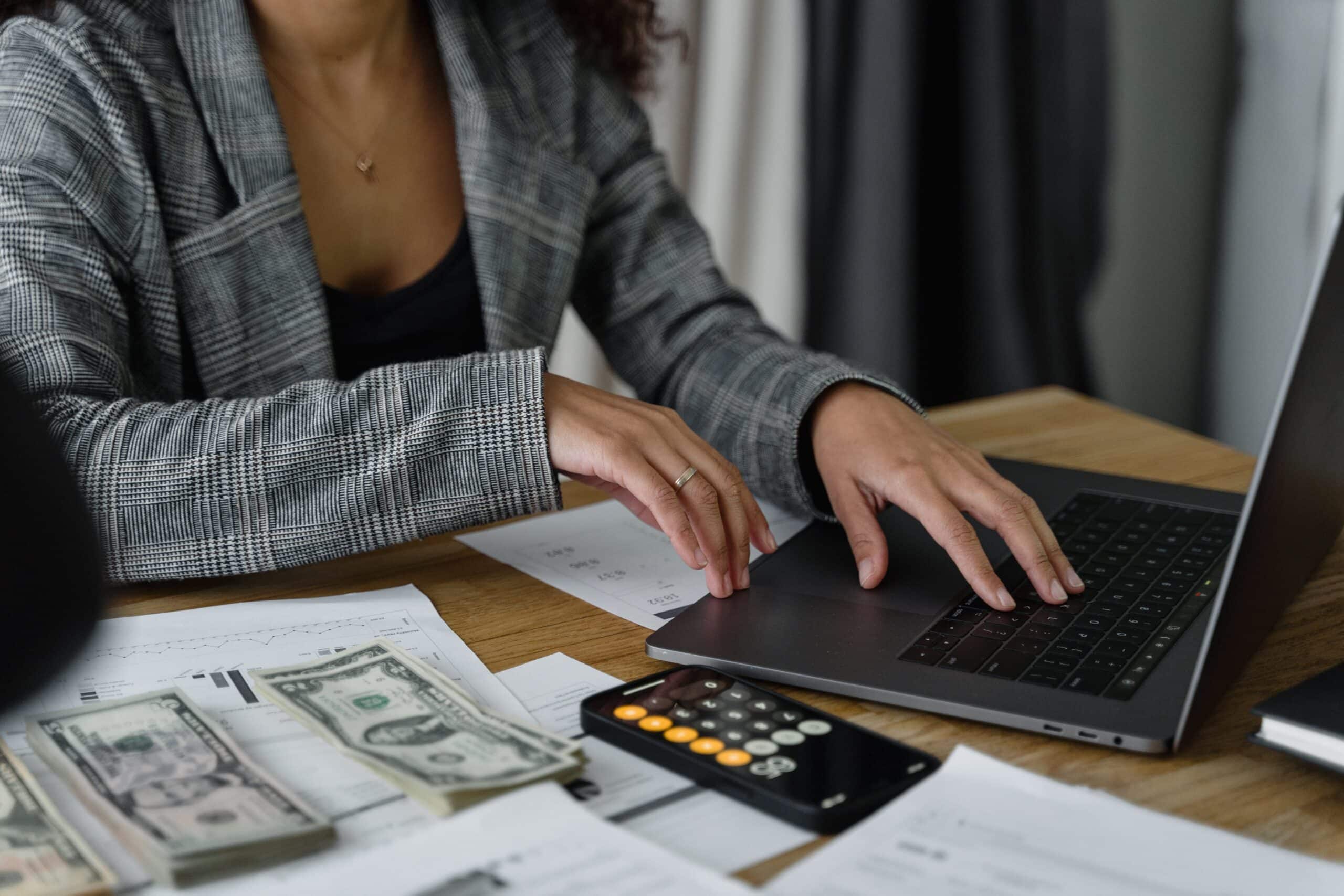 Event Budget Template Photo by Tima Miroshnichenko: https://www.pexels.com/photo/a-woman-in-plaid-blazer-using-her-laptop-6693661/