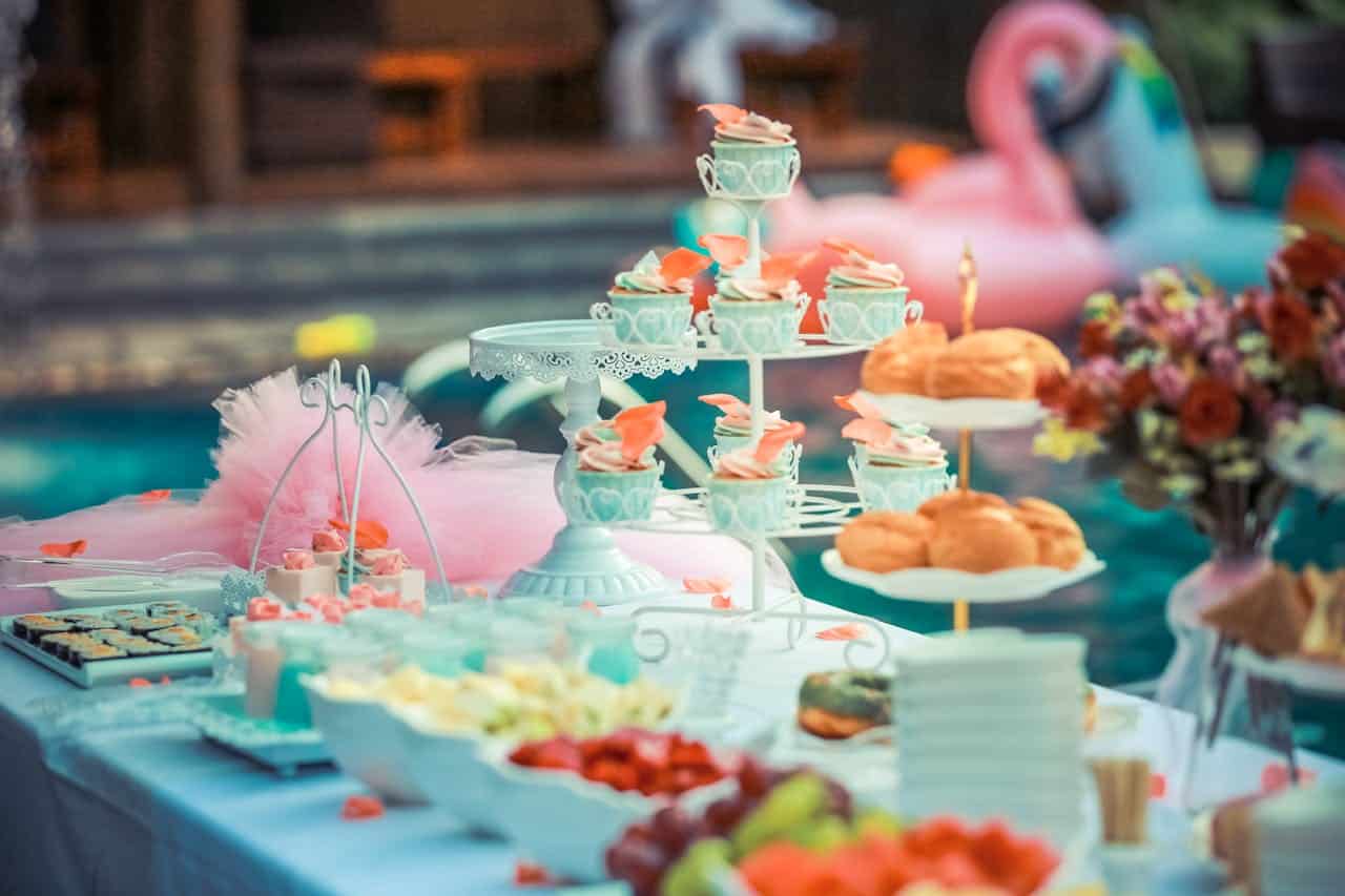 Image title: Corporate Events New York Image Description: Various desserts on a table at a corporate event. Image URL: https://www.pexels.com/photo/cupcakes-display-on-cupcake-rack-587739/