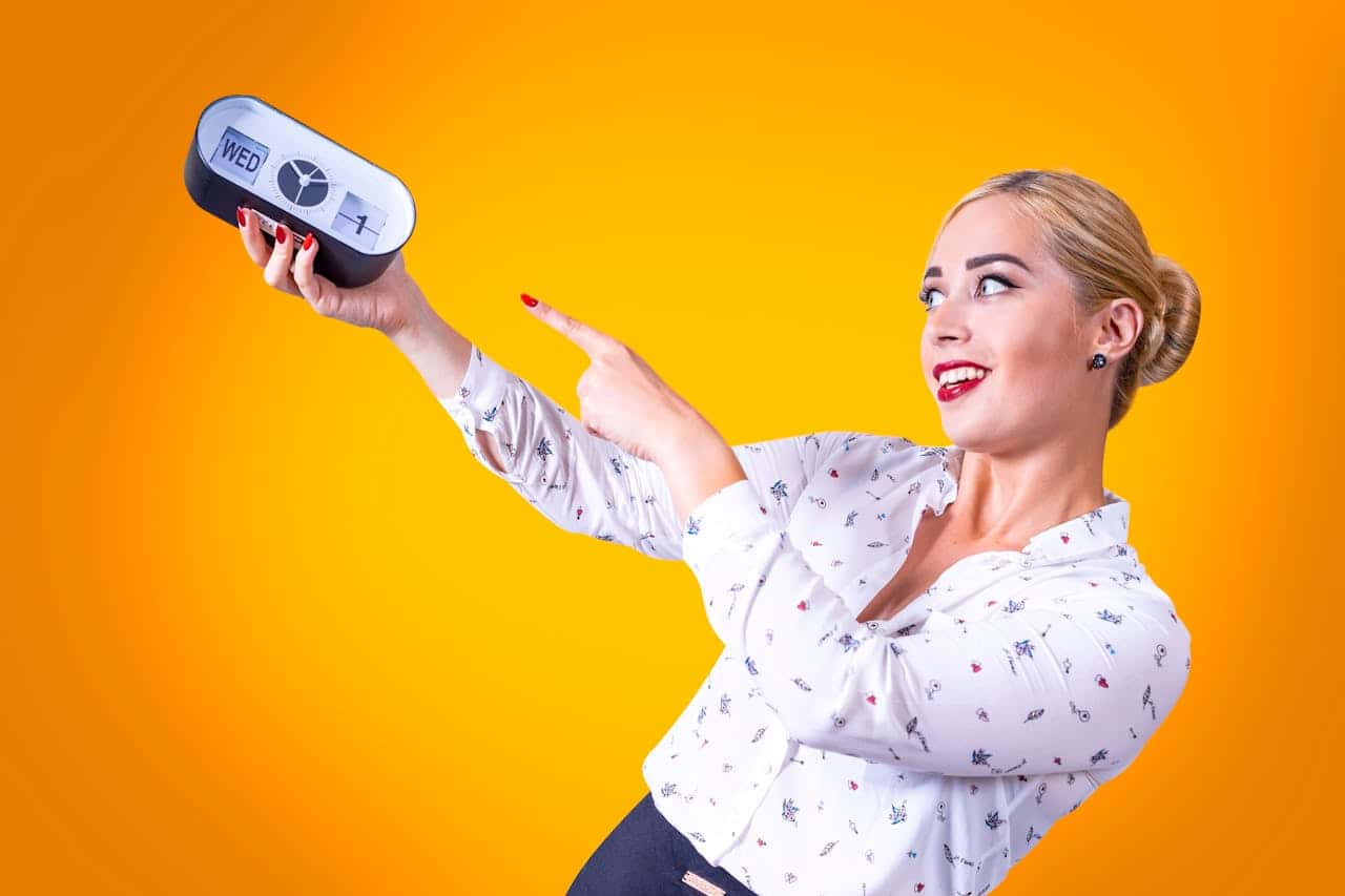 Photo by Oleksandr P: https://www.pexels.com/photo/woman-pointing-on-the-clock-12955762/ -- corporate event planner schedule