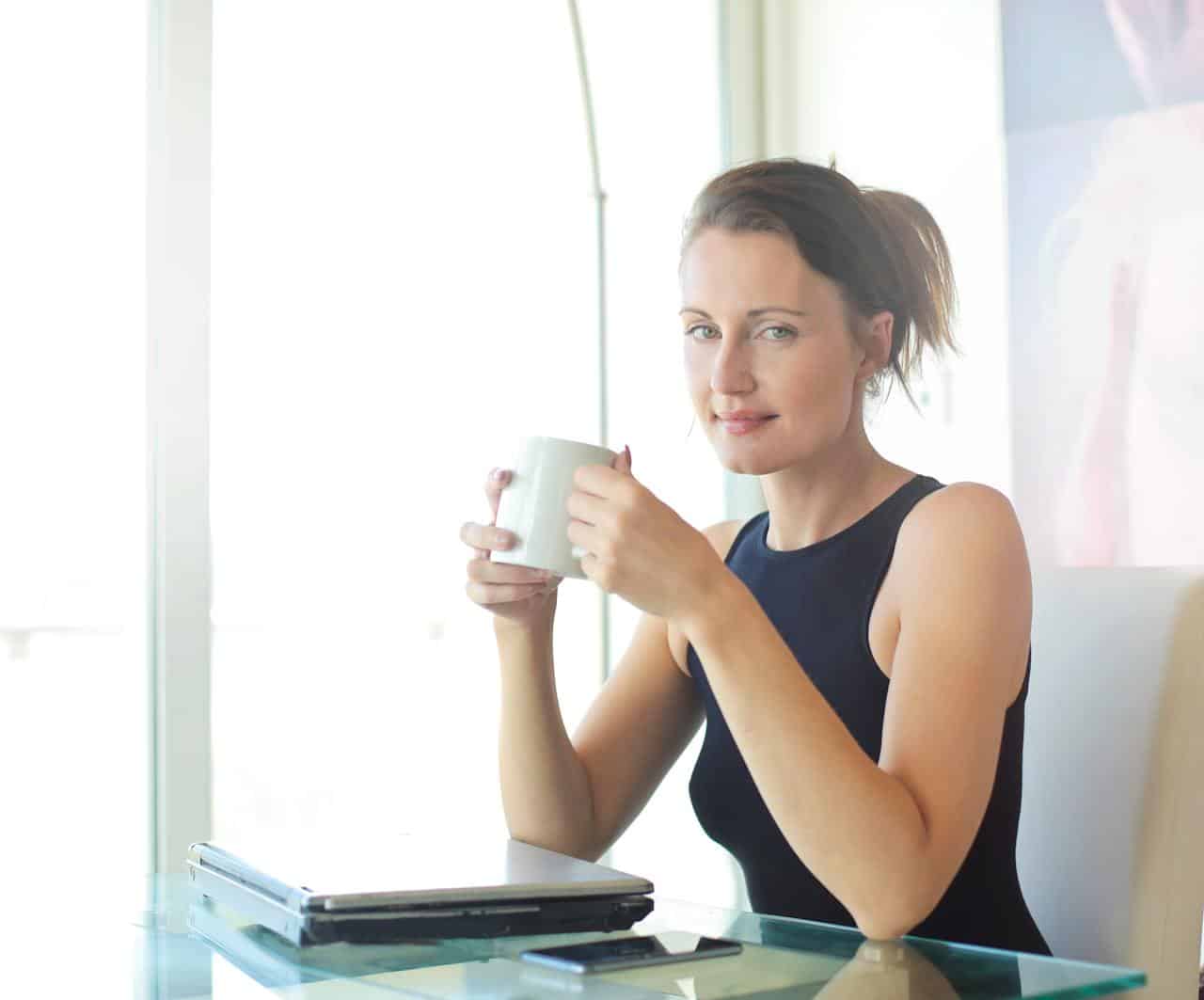 Photo by Andrea Piacquadio: https://www.pexels.com/photo/woman-in-black-tank-top-holding-white-ceramic-cup-3779760/ - successful entrepreneur