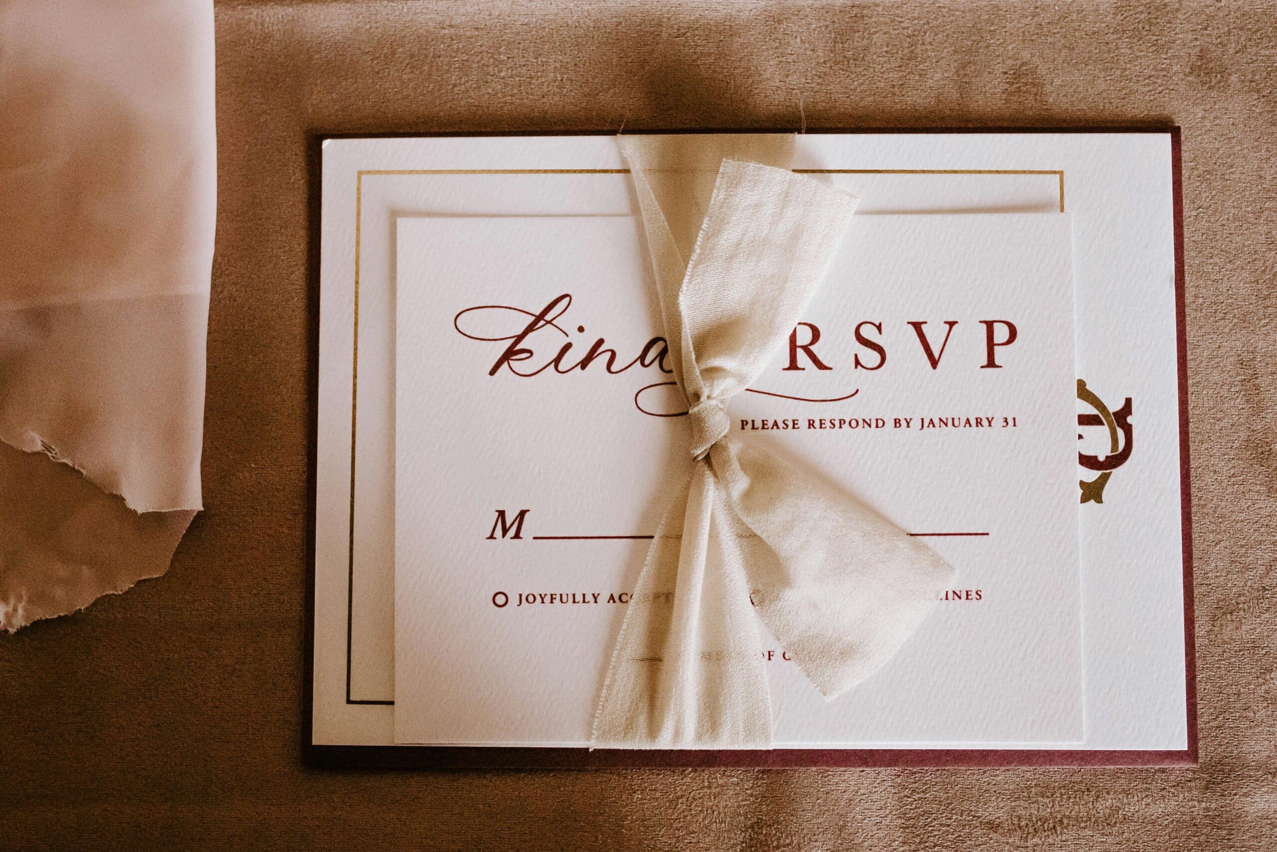 Photo by Tara Winstead: https://www.pexels.com/photo/invitation-card-with-the-inscription-tied-with-ribbon-6479559/ -- event invitation
