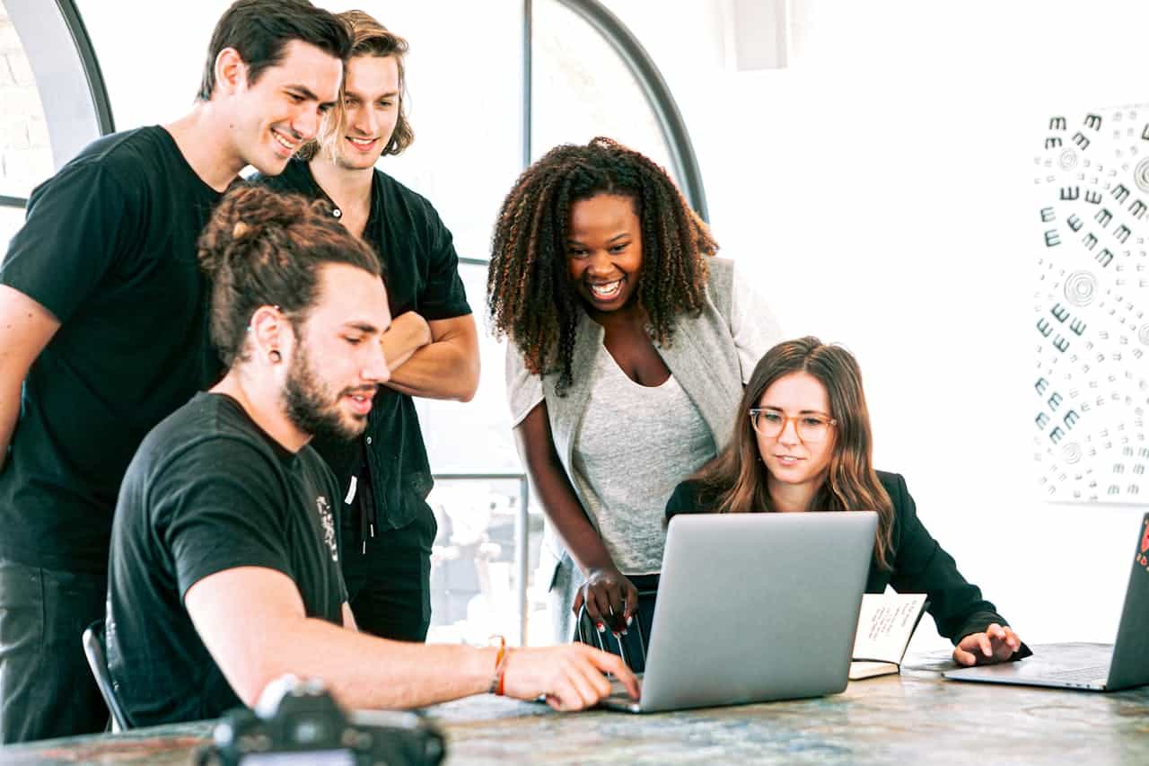 Photo by Canva Studio: https://www.pexels.com/photo/man-in-black-crew-neck-t-shirt-sitting-beside-woman-in-gray-crew-neck-t-shirt-3153201/ -- networking
