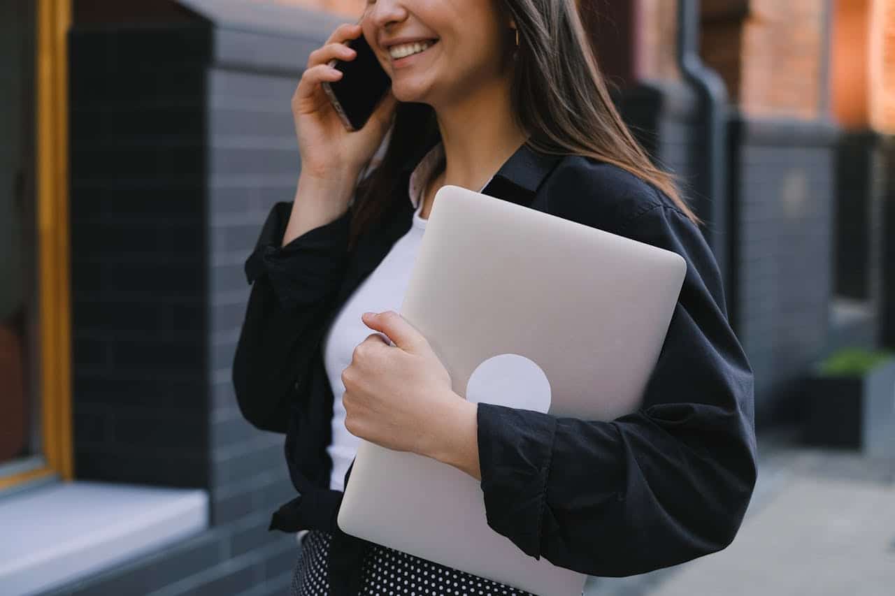 Photo by Anna Shvets: https://www.pexels.com/photo/a-woman-holding-a-laptop-12679939/  -- professional woman