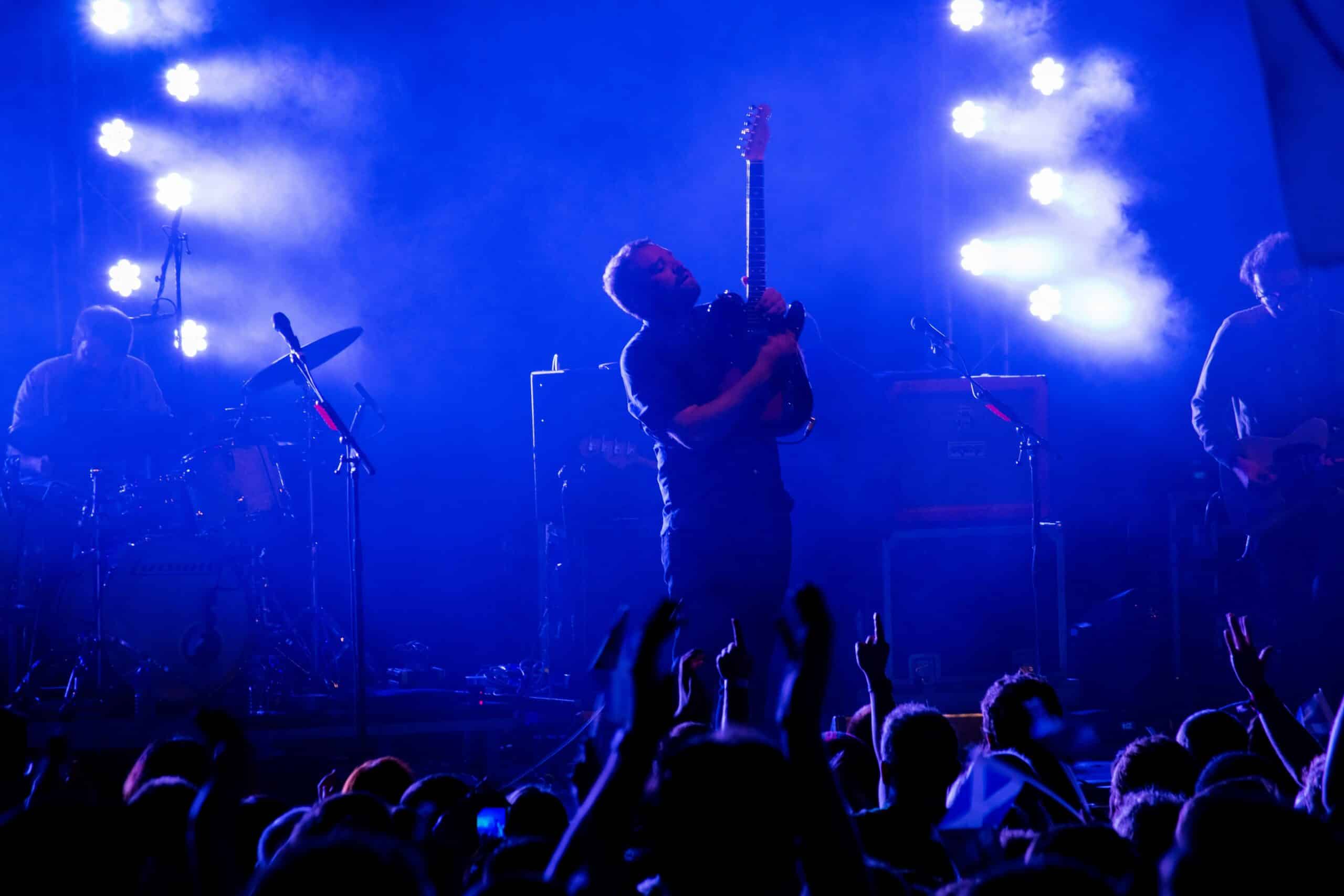 Photo by Gary Ellis on Unsplash https://unsplash.com/photos/man-in-black-t-shirt-playing-guitar-on-stage-XtZvUJ0YYHg?utm_content=creditCopyText&utm_medium=referral&utm_source=unsplash -- event entertainment