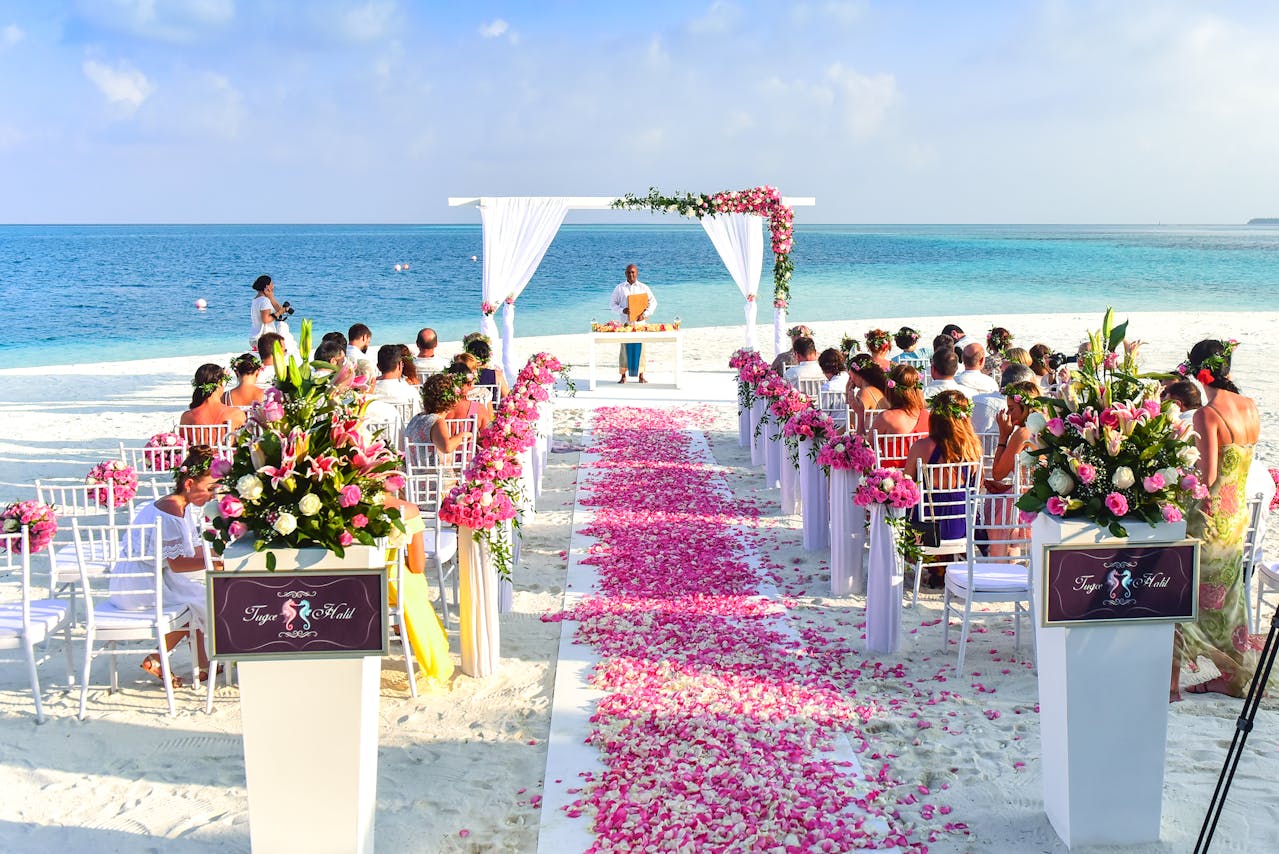 Photo by Asad Photo Maldives: https://www.pexels.com/photo/beach-wedding-ceremony-during-daytime-169198/ -- niche events, destination wedding