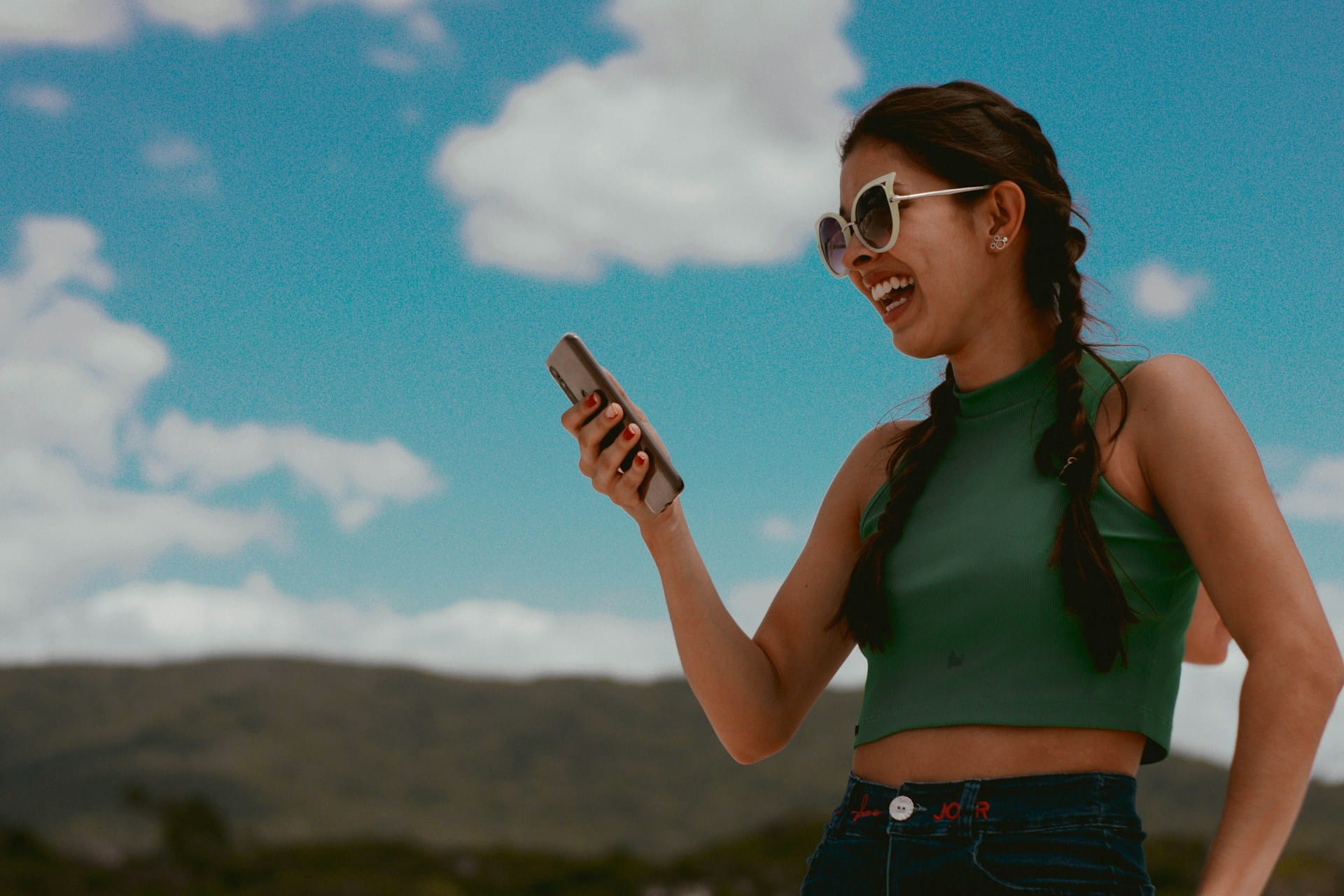 https://unsplash.com/photos/woman-in-green-tank-top-holding-smartphone-during-daytime-dSsXm15D9hg Photo by Carol Magalhães on Unsplash -- influencer marketing