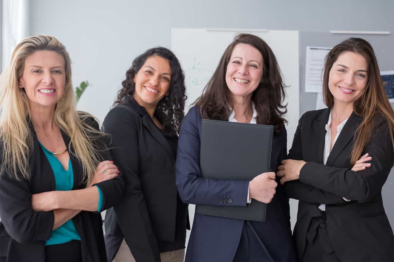 Photo by Kampus Production: https://www.pexels.com/photo/smiling-women-wearing-black-blazers-8171197/ - corporate events