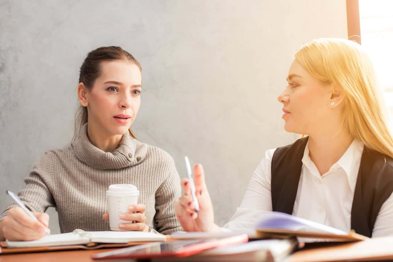 Photo by Tirachard Kumtanom: https://www.pexels.com/photo/two-women-holding-pen-601170/ -- sales funnel planning