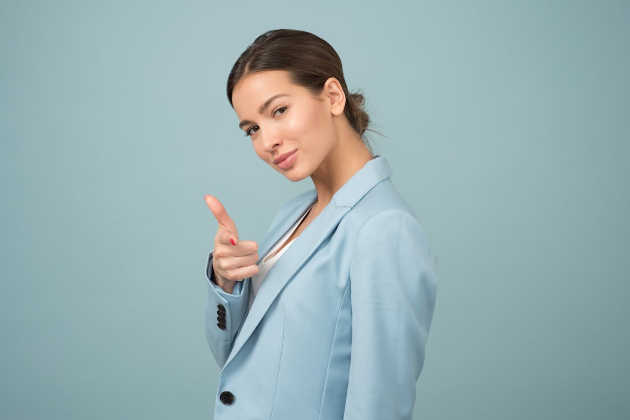 Photo by Moose Photos: https://www.pexels.com/photo/woman-wearing-blue-shawl-lapel-suit-jacket-1036622/ -- top NYC event planners