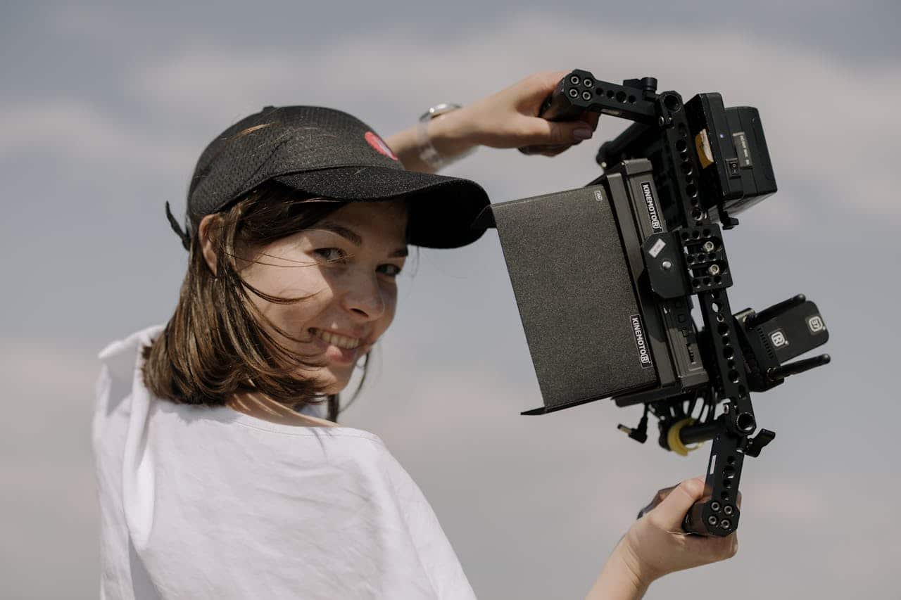 https://www.pexels.com/photo/brunette-woman-recording-video-with-camera-5265828/ Image from Pexels, cottonbro studio -- behind-the-scenes