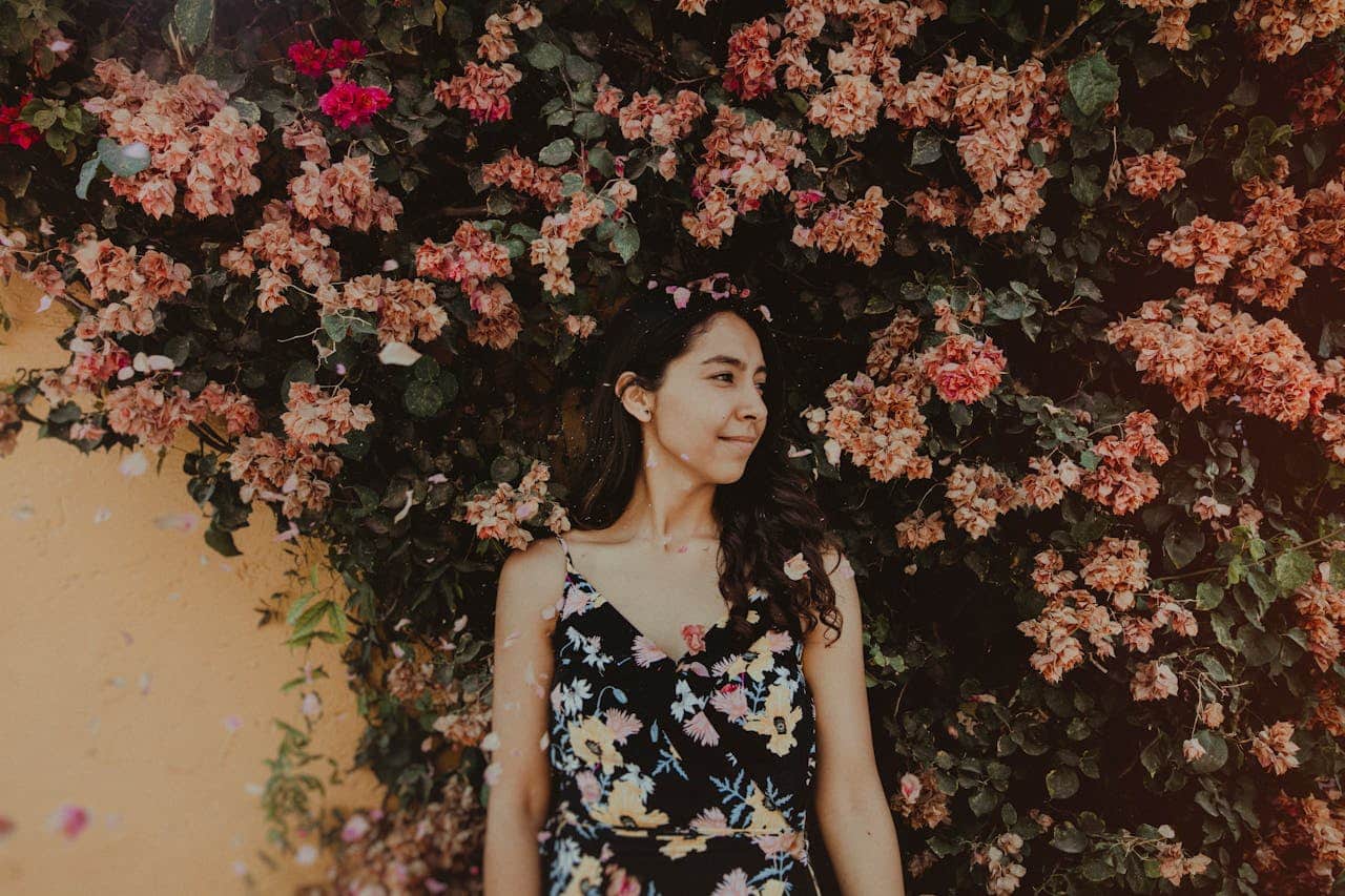 https://www.pexels.com/photo/photo-of-woman-near-flowers-2564841/ Photo by Jose Luis Photogropher