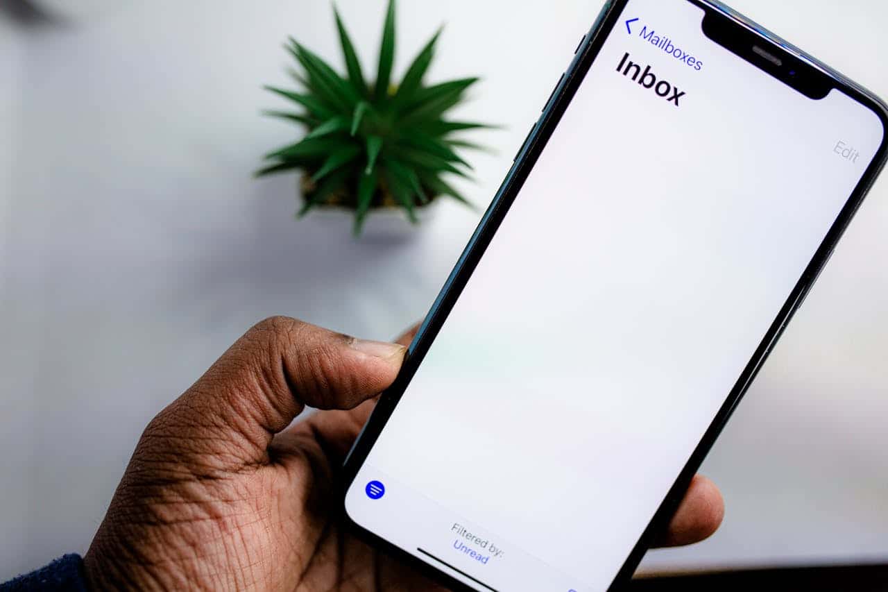 Photo by Solen Feyissa: https://www.pexels.com/photo/person-holding-a-smartphone-5744250/ -- email marketing