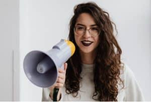 Photo by Photo By: Kaboompics.com: https://www.pexels.com/photo/woman-in-white-sweatshirt-holding-a-megaphone-8107301/ 
influencer partnerships