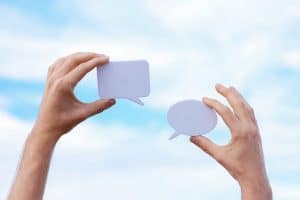 Photo by Cup of  Couple: https://www.pexels.com/photo/close-up-of-man-holding-paper-cutouts-in-the-shape-of-conversational-clouds-8015694/ 