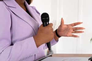 Photo by Mikhail Nilov: https://www.pexels.com/photo/a-businesswoman-giving-a-speech-8872474/